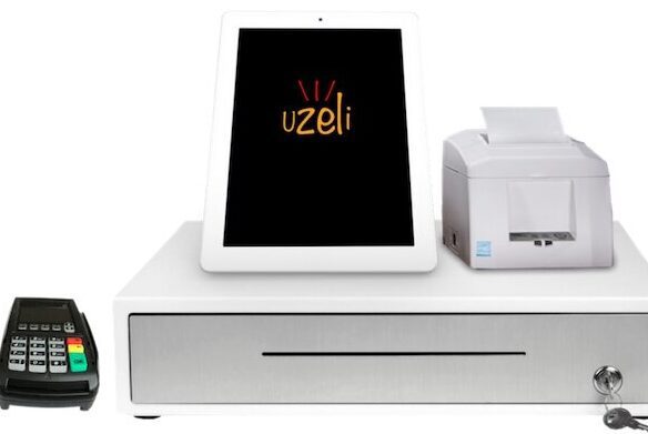 A white point-of-sale system with tablet, receipt printer, and cash drawer.